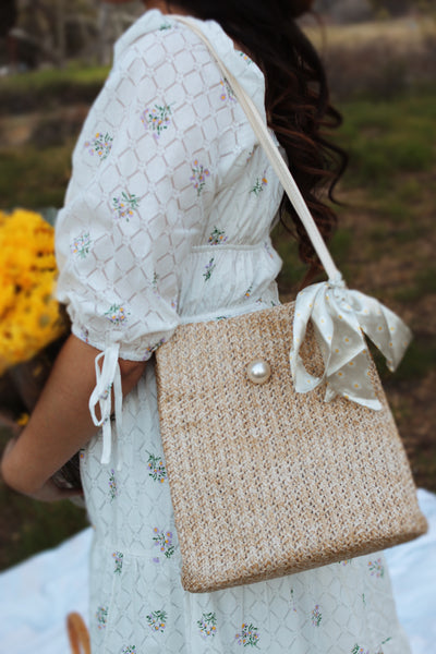 "Daisies in a woven bag" tote bag