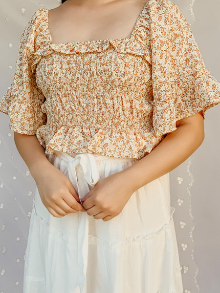 "Flowers painted on her Skin" floral top